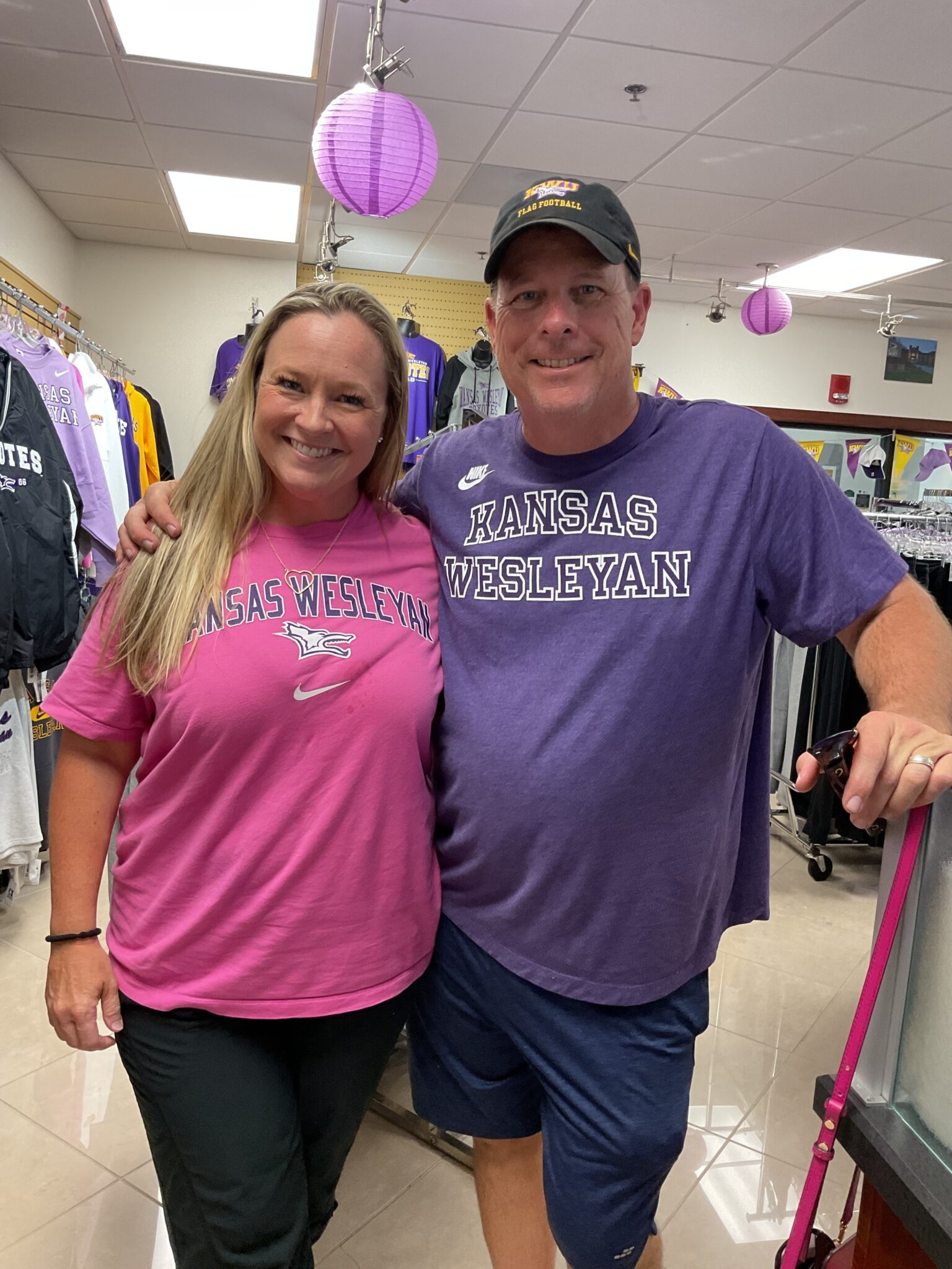 a person standing in front of a group of people posing for the camera